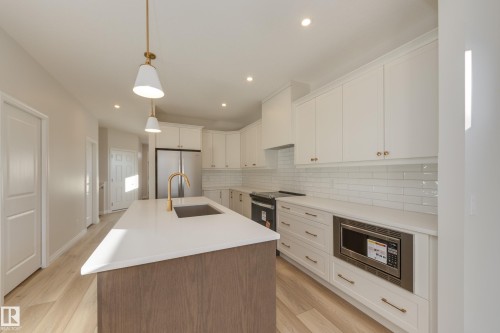 170 Stonehouse Way, Leduc, AB - Indoor Photo Showing Kitchen With Stainless Steel Kitchen With Upgraded Kitchen