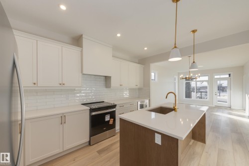 170 Stonehouse Way, Leduc, AB - Indoor Photo Showing Kitchen With Upgraded Kitchen