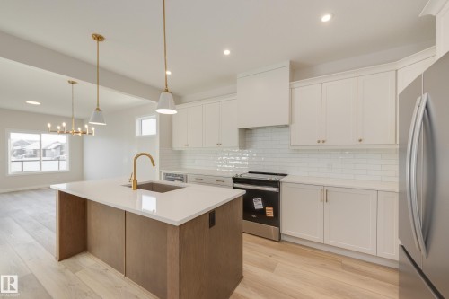 196 Stonehouse Way, Leduc, AB - Indoor Photo Showing Kitchen With Stainless Steel Kitchen With Upgraded Kitchen