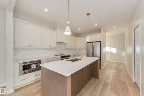 196 Stonehouse Way, Leduc, AB - Indoor Photo Showing Kitchen With Stainless Steel Kitchen With Upgraded Kitchen