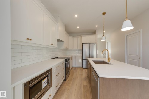 196 Stonehouse Way, Leduc, AB - Indoor Photo Showing Kitchen With Stainless Steel Kitchen With Upgraded Kitchen