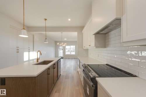 196 Stonehouse Way, Leduc, AB - Indoor Photo Showing Kitchen With Upgraded Kitchen
