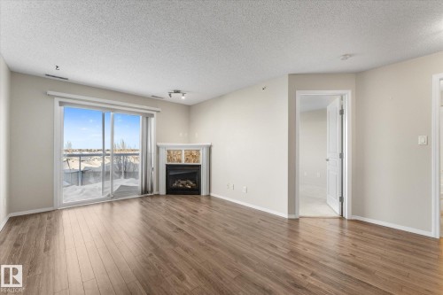 409 16035 132 Street, Edmonton, AB - Indoor Photo Showing Living Room With Fireplace
