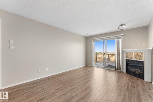 409 16035 132 Street, Edmonton, AB - Indoor Photo Showing Other Room With Fireplace