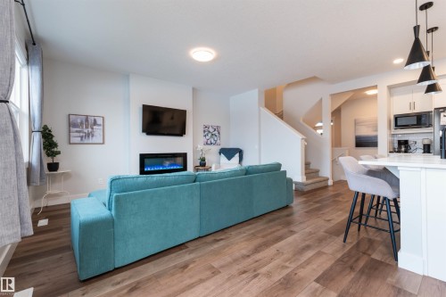 3805 Cherry Loop, Edmonton, AB - Indoor Photo Showing Living Room With Fireplace