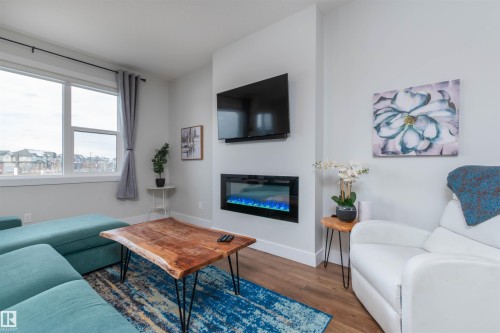 3805 Cherry Loop, Edmonton, AB - Indoor Photo Showing Living Room With Fireplace