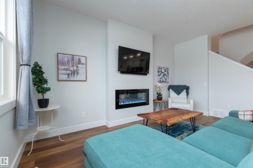 3805 Cherry Loop, Edmonton, AB - Indoor Photo Showing Living Room With Fireplace