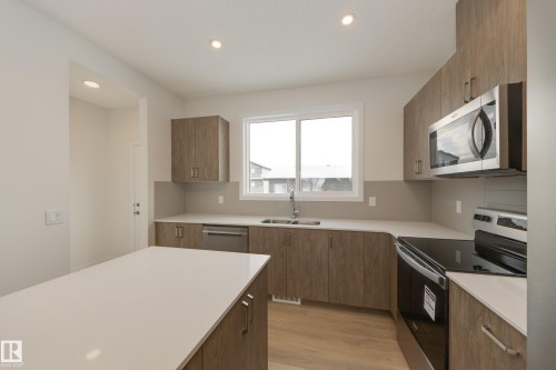 307 173 Avenue, Edmonton, AB - Indoor Photo Showing Kitchen With Double Sink