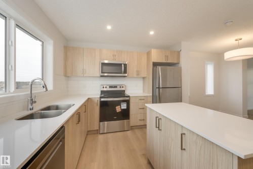 17235 4 Street, Edmonton, AB - Indoor Photo Showing Kitchen With Stainless Steel Kitchen With Double Sink With Upgraded Kitchen