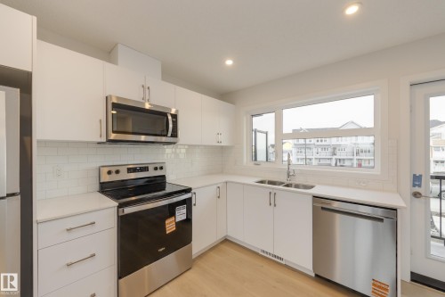 17242 4 Street, Edmonton, AB - Indoor Photo Showing Kitchen With Stainless Steel Kitchen With Double Sink