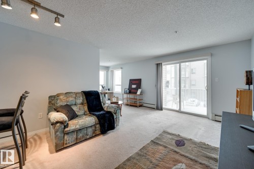 201 155 Edwards Drive, Edmonton, AB - Indoor Photo Showing Living Room