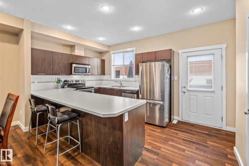 9 6075 Schonsee Way, Edmonton, AB - Indoor Photo Showing Kitchen With Upgraded Kitchen