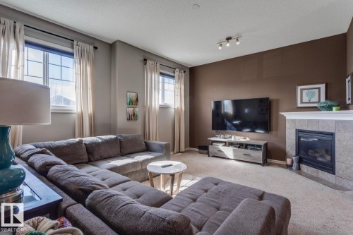4109 Charles Link Link, Edmonton, AB - Indoor Photo Showing Living Room With Fireplace