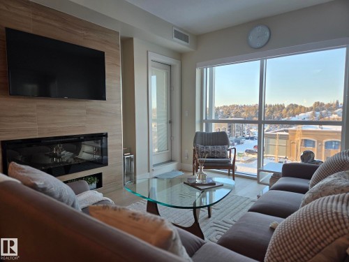 718 200 Bellerose Drive, St. Albert, AB - Indoor Photo Showing Living Room With Fireplace