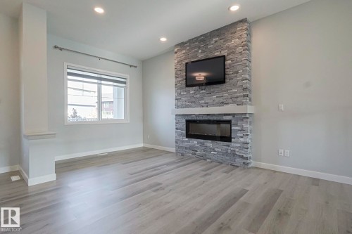 1653 Plum Circle Circle, Edmonton, AB - Indoor Photo Showing Living Room With Fireplace
