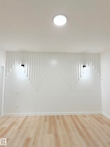 Detailed view of wood finished floors - 3320 Chickadee Drive, Edmonton, AB - Indoor Photo Showing Other Room