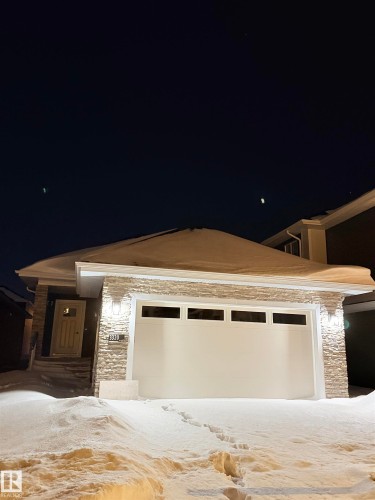 Contemporary home featuring stone siding and a garage - 3320 Chickadee Drive, Edmonton, AB - Outdoor