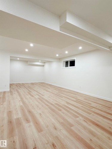 Finished basement featuring light wood-style flooring and recessed lighting - 3320 Chickadee Drive, Edmonton, AB - Indoor