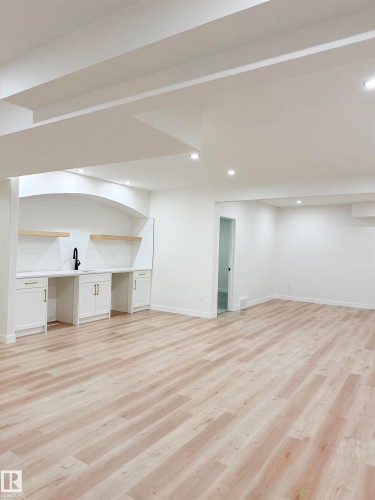 Basement with light wood-type flooring and recessed lighting - 3320 Chickadee Drive, Edmonton, AB - Indoor Photo Showing Other Room