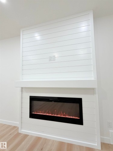 3320 Chickadee Drive, Edmonton, AB - Indoor Photo Showing Living Room With Fireplace