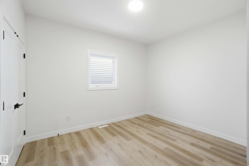 Spare room featuring light wood-style floors and baseboards - 3320 Chickadee Drive, Edmonton, AB - Indoor Photo Showing Other Room