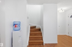 Staircase with baseboards and wood finished floors - 