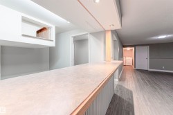 Kitchen featuring light countertops and light wood-style floors - 