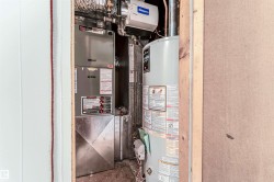 Utilities featuring gas water heater and heating unit - 