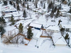 Snowy aerial view featuring a residential view - 