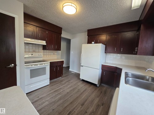 119 Diamond Drive, Millet, AB - Indoor Photo Showing Kitchen With Double Sink