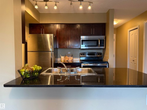 214 274 Mcconachie Drive, Edmonton, AB - Indoor Photo Showing Kitchen With Stainless Steel Kitchen With Double Sink