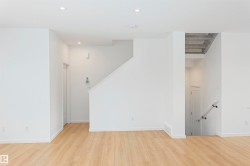 Unfurnished living room with light wood-style flooring and recessed lighting - 