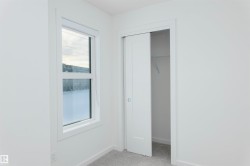 Unfurnished bedroom with a closet and light carpet - 