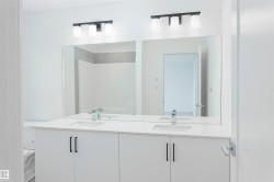 Full bath with double vanity and a shower - 
