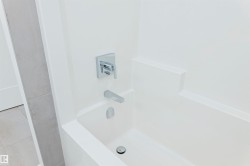 Bathroom view of washtub / shower combination - 