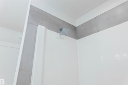 Bathroom view of a tile shower - 