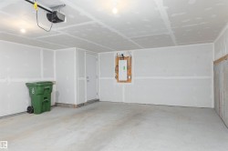 Garage with electric panel and a garage door opener - 