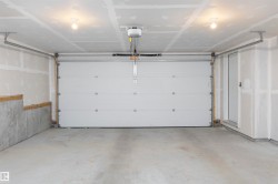 Garage featuring a garage door opener - 