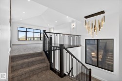 Staircase with carpet and recessed lighting - 