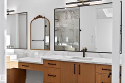 Full bathroom featuring a marble finish shower and vanity - 