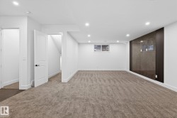 Finished basement featuring recessed lighting and carpet flooring - 