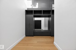 Corridor featuring light wood finished floors and baseboards - 