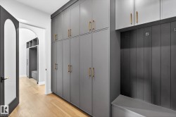 Mudroom with light wood-style floors - 