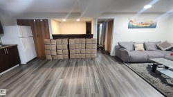 Living room with wood finished floors and recessed lighting - 