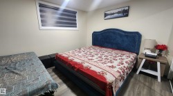 Bedroom featuring wood finished floors - 