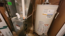 Utility room featuring gas water heater - 