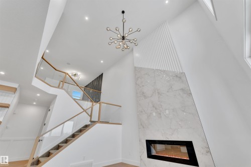 744 Astoria Way, Devon, AB - Indoor Photo Showing Other Room With Fireplace