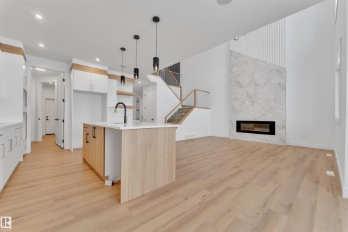 744 Astoria Way, Devon, AB - Indoor Photo Showing Kitchen With Fireplace