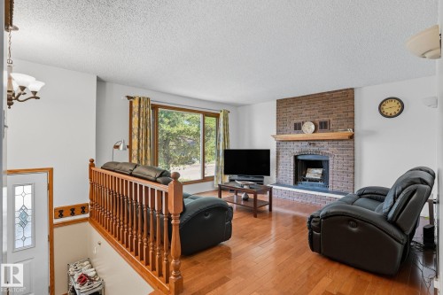 5508 54 Street, Beaumont, AB - Indoor Photo Showing Living Room With Fireplace