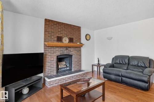 5508 54 Street, Beaumont, AB - Indoor Photo Showing Living Room With Fireplace